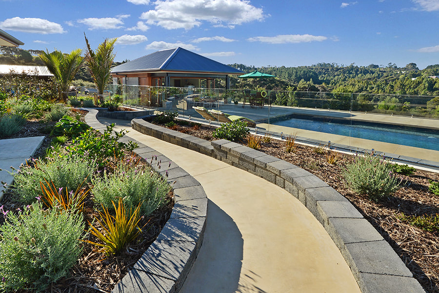 Waimauku new build home with landscaped garden and walkway to outdoor pool